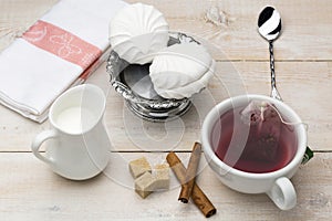 Set of cup red tea and dessert