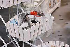 A set of cups in a wooden basket. Toning