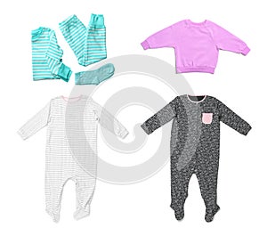 Set of cute child clothes on white background, top view.