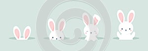 Set of cute Easter bunnies peeking out of burrows. Vector illustration