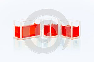 Set of cuvettes with red liquid