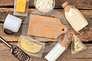 Set of dairy products on wooden background.