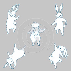 Set with dancing little happy white rabbits. Hare symbol new year 2023. Five cute bunnies in different poses isolated on