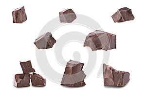 Set of dark broken chocolate pieces isolated on white background,close up