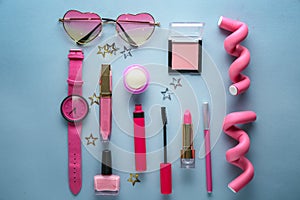 Set of decorative cosmetics with accessories on color background