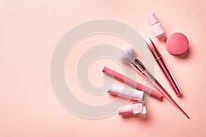 Set of decorative cosmetics on pink background