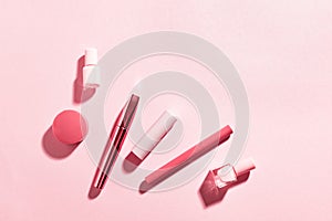 Set of decorative cosmetics on pink background