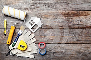 Set of decorator`s tools on wooden background