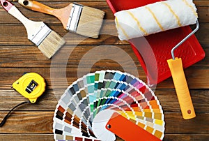 Set of decorator`s tools on wooden background