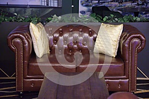 A set of deep ruby red maroon luxury classic sofa seat set on display