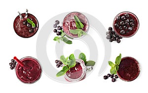 Set of delicious acai juice in different glassware on white background