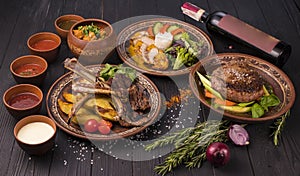 Set with delicious food on ethnic plates