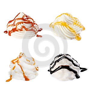 Set of delicious fresh whipped cream with syrups on white background