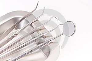 Set of dental stainless tools used by dentists in stomatology office