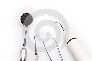 Set of dental tools on white background.