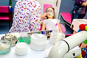 Set of dentist tools and equipment on clinic desktop