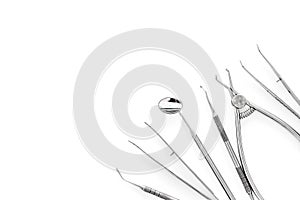 Set of dentists tools including round mirror on white background top view copyspace