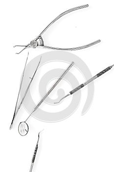 Set of dentists tools including round mirror on white background top view copyspace