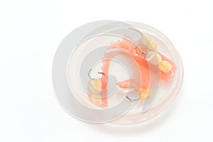 Set of Dentures in A Glass of Water