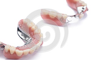 Set of dentures on white background
