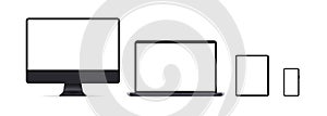 Set of devices icons. Realistic set laptop, computer monitor, tablet and phone in dark grey color with empty display. Vector EPS