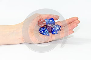 set of Dice for fantasy, dnd, rpg in hand,  on white background. selective focusing