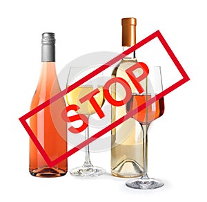 Set of different alcohol drinks and STOP sign on background
