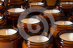 A set of different aroma Soy and coconut wax candles in brown glass jars. Scented handmade candle. Soy candles in a Amber jar. photo