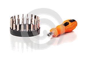 A set of different attachments for a head screwdriver with a screwdriver on a white background