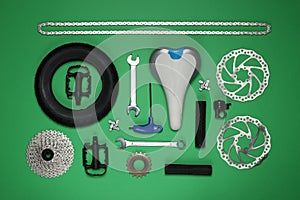 Set of different bicycle tools and parts on  background, flat lay