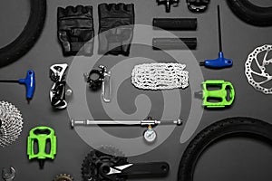 Set of different bicycle tools and parts on background, flat lay