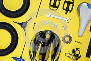 Set of different bicycle tools and parts on background, flat lay