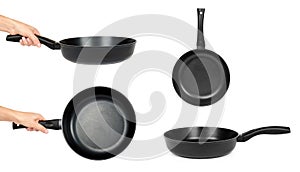 Set of different black fry pans in hand isolated on white background
