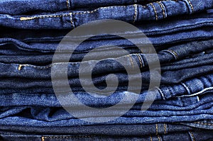 Set of different blue jeans. Detail of nice blue jeans. Jeans texture or denim background. Blue denim jeans texture, fabric grunge