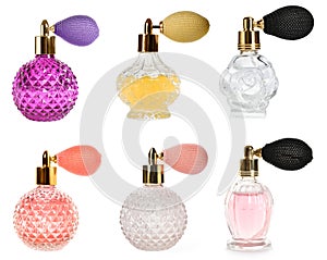 Set with different bottles of luxury perfume on white background