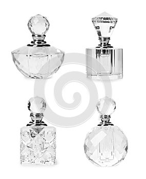 Set with different bottles of luxury perfume on white background