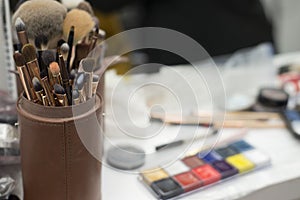 Set of different brushes in a case. Make-up artist draws on the table