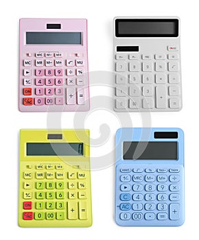Set with different calculators on white background, top view