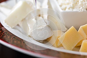 Set of different cheeses, brie cheese, mozzarella and feta cheese