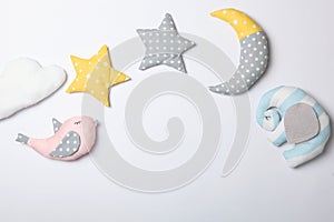 Set of different children's toys on a colored background top view.