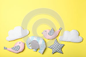 Set of different children's toys on a colored background top view.