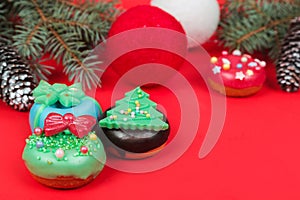 Set of different Christmas cookies donats and cakesicles on red background. Christmas decorations.