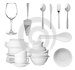 Set with different clean dishware and cutlery on white background