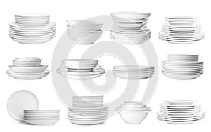 Set with different clean dishware on white background