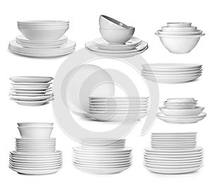 Set with different clean dishware on white background