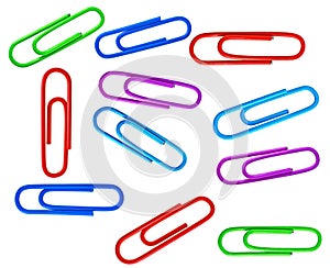 Set of different colored paperclips on white background