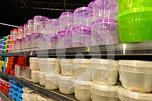 A set of different colors and sizes of containers in the store