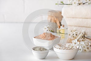Set of different cosmetic clay mud powders on white background. Ingredients for homemade facial and body mask or scrub