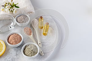 Set of different cosmetic clay mud powders on white background. Ingredients for homemade facial and body mask or scrub
