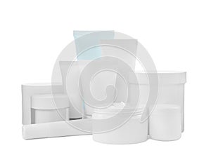 Set of different creams on white background
